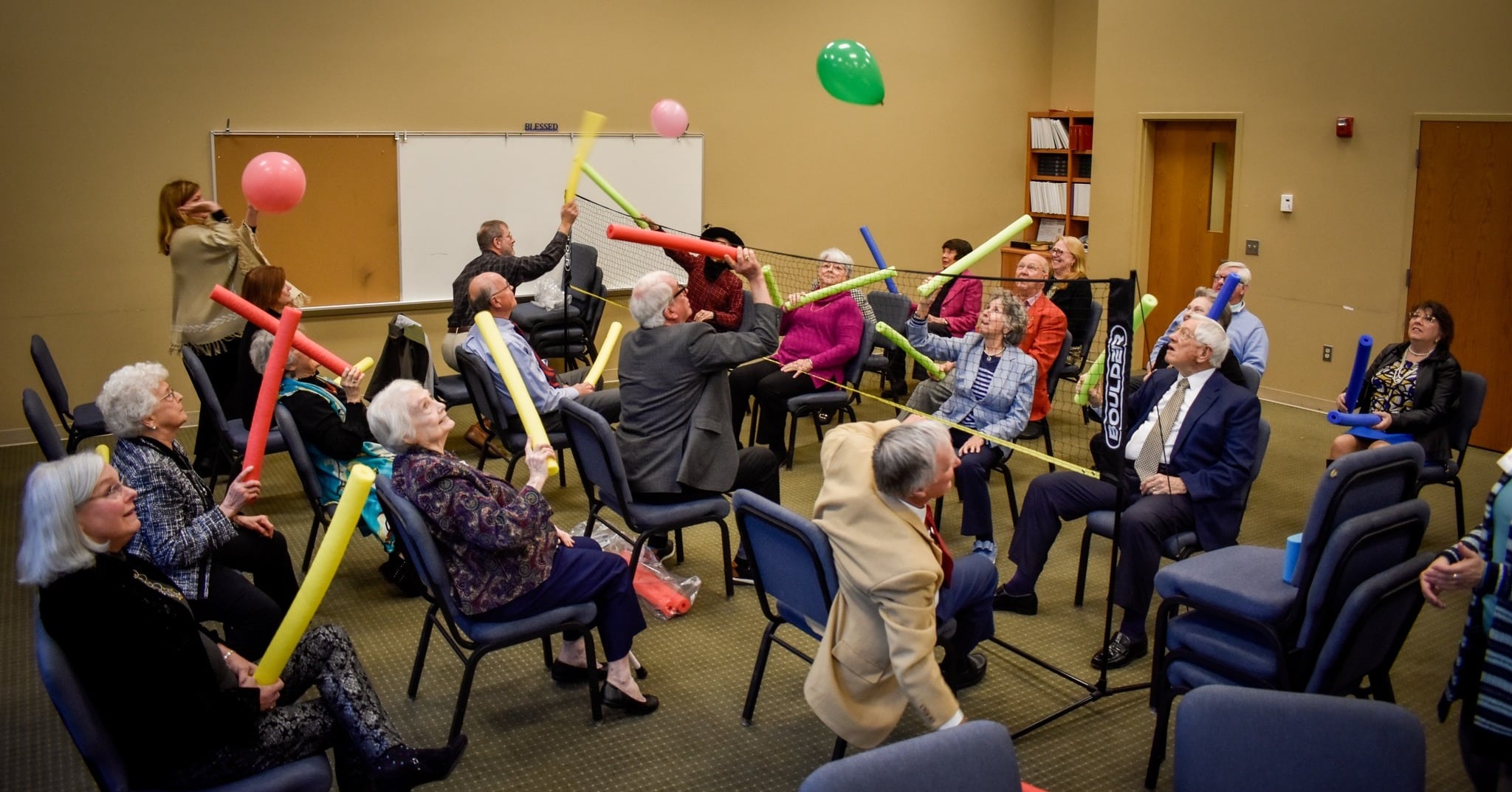 Abide Volunteers and participants enjoy a fun and active moment during a special RFA event at Abide Respite Ministry at First-Centenary United Methodist