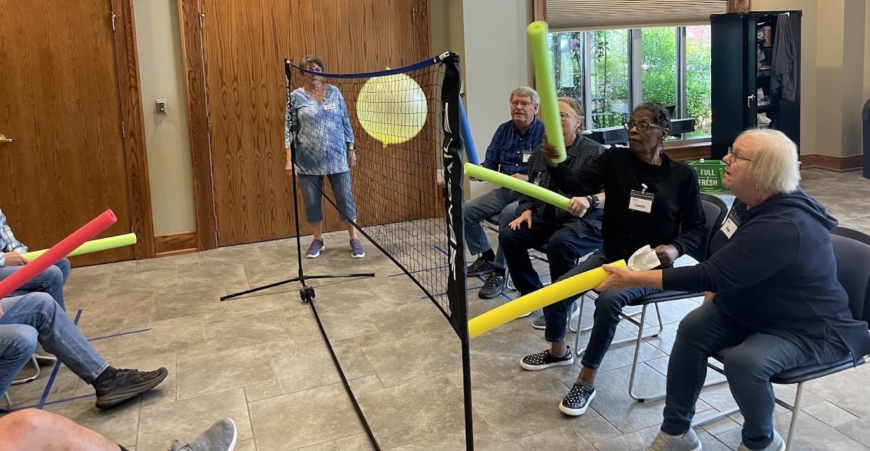 memory connection Volunteers and participants engage in a fun game during a special RFA event at The Memory Connection at Woodland United Methodist Church.