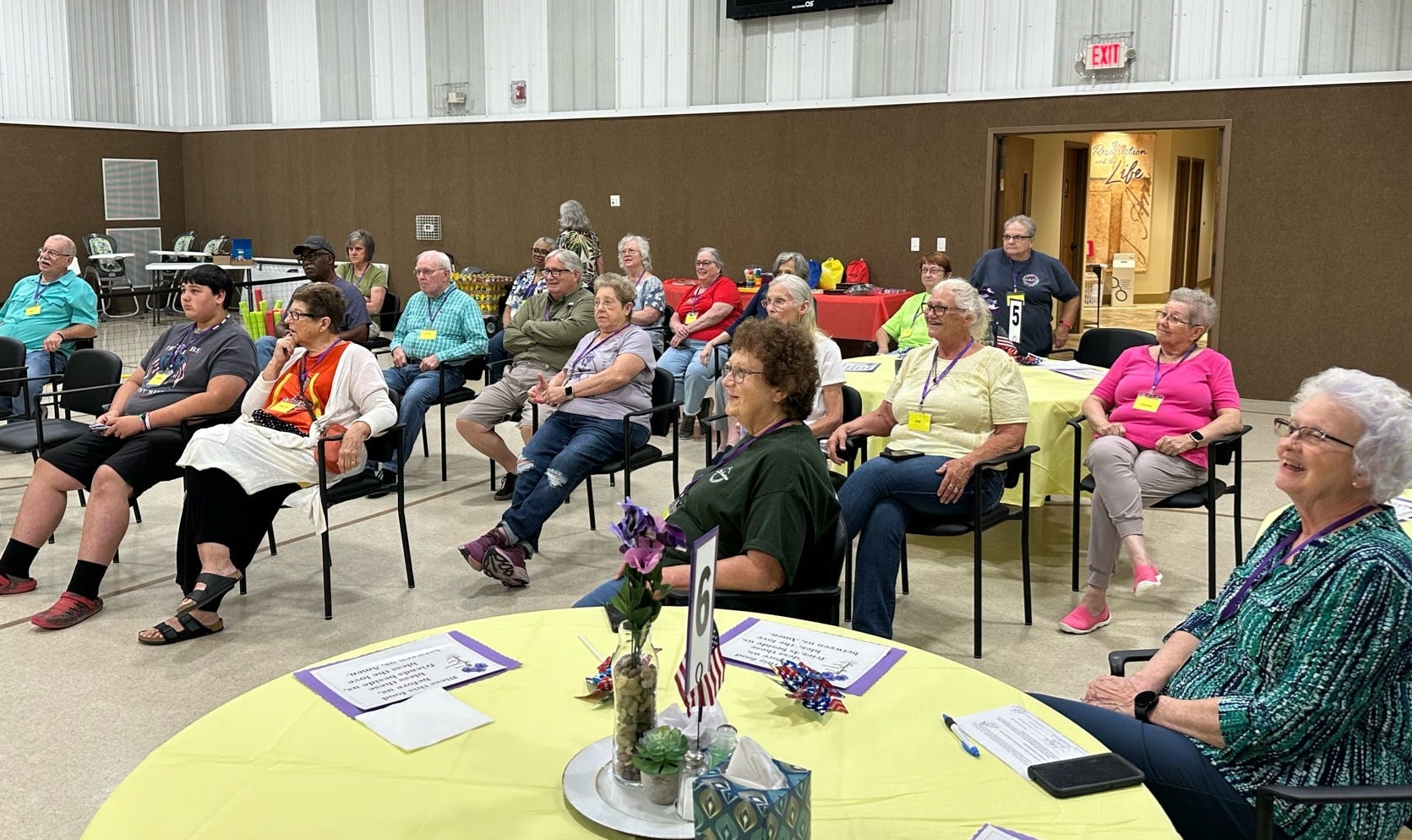 rfa-locations-tennesseparis-tn Group of volunteers and participants seated and engaged in an activity at a Respite for All event in Paris, Tennessee.