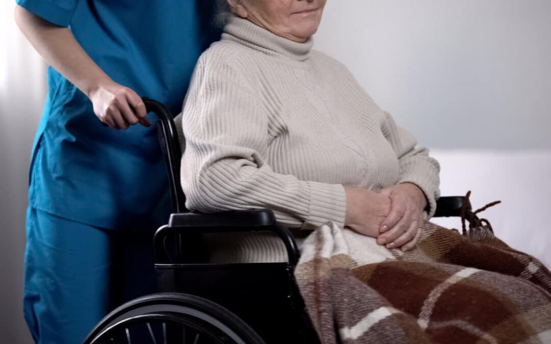 Benefits of respite care – elderly woman in a wheelchair receiving support from a caregiver